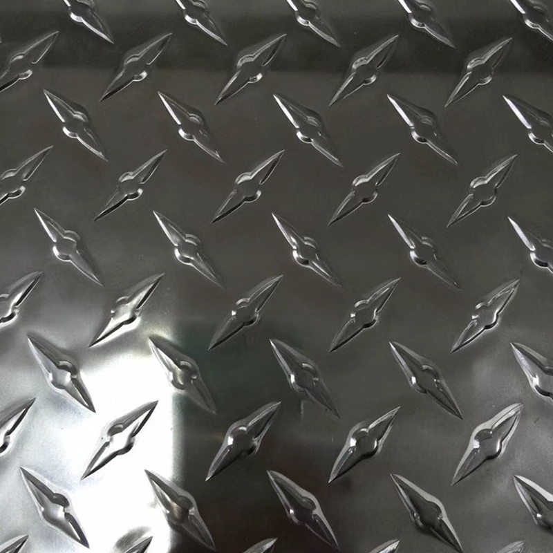 Aluminum coil rolls ready for surface finishing in a manufacturing facility